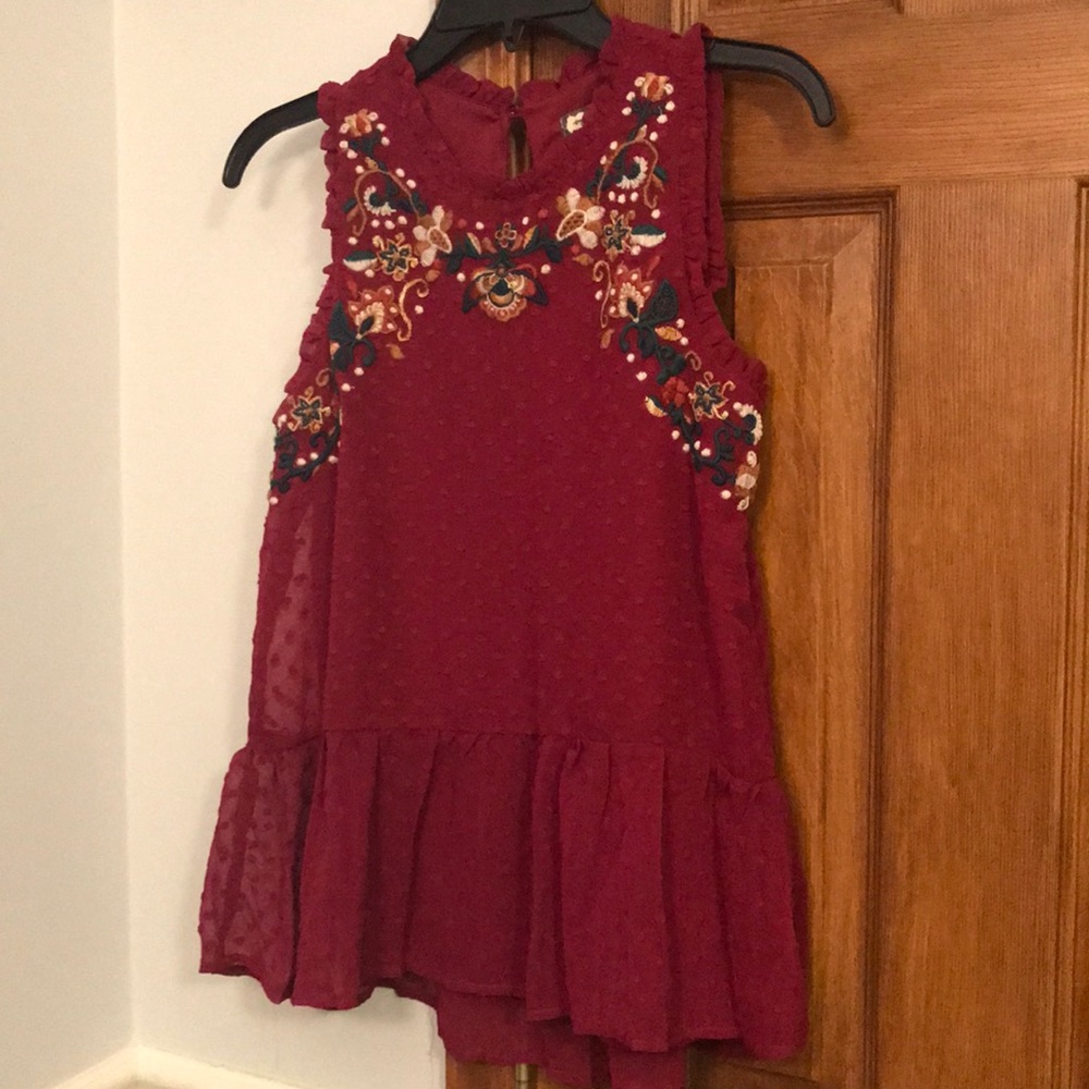 Burgundy flowy cut blouse with floral design